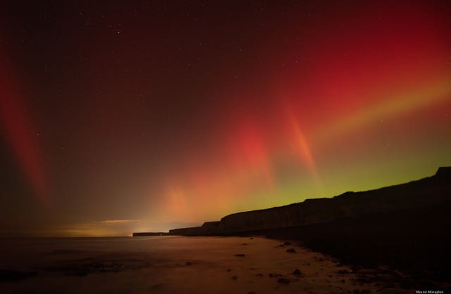 Aurora Borealis above sea clifs