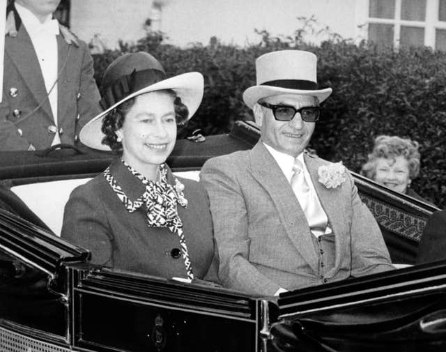 The Queen with the then Shah of Iran (Archive/PA)