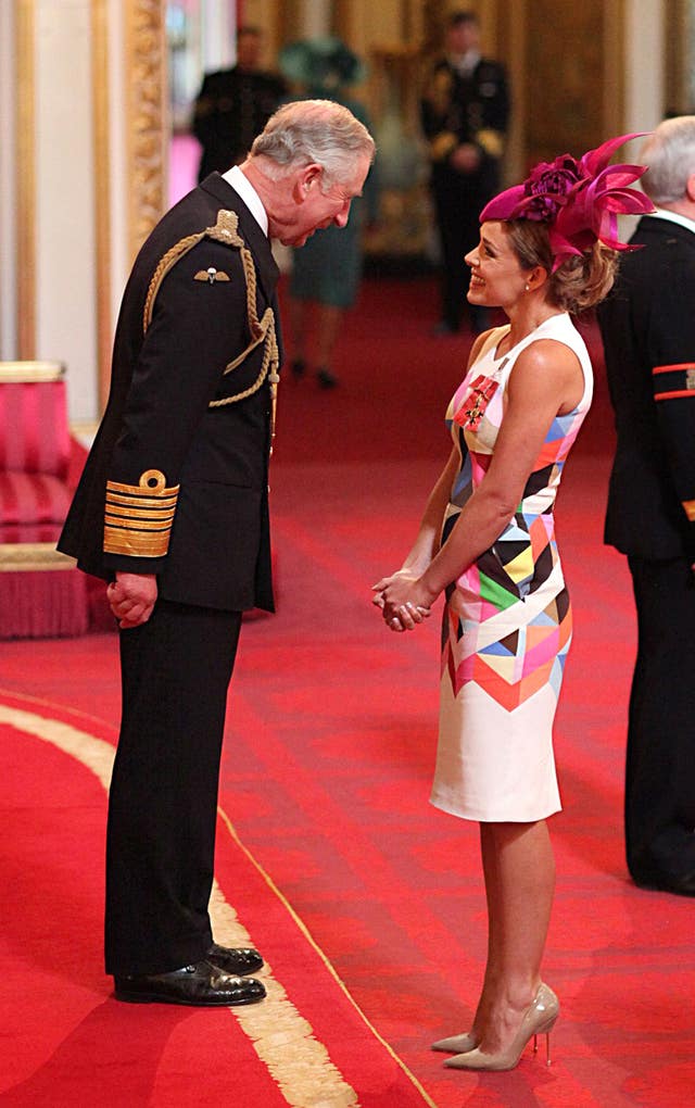 Singer Katherine Jenkins is made an OBE by the Prince of Wales during an investiture ceremony at Buckingham Palace in central London in 2014
