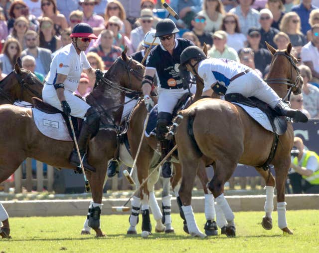 The Duke of Cambridge, centre, takes part in the Maserati Royal Charity Polo Trophy