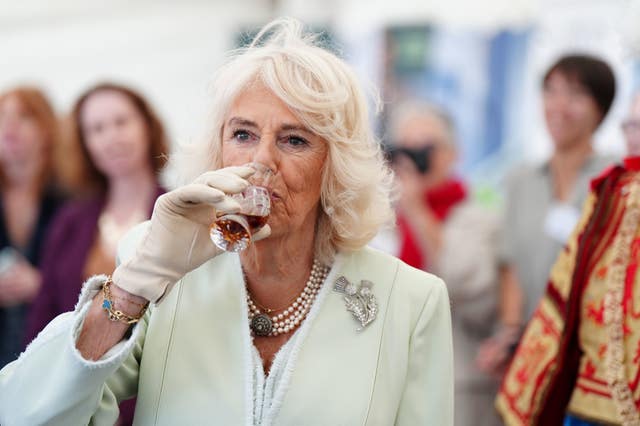 The Queen tries a glass of Duncan Taylor whisky as she attends a celebration at Edinburgh Castle to mark the 900th anniversary of the City of Edinburgh