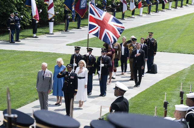The King and Queen at the Memorial Amphitheatre during a visit to Arlington National Cemetery in Arlington, Virginia