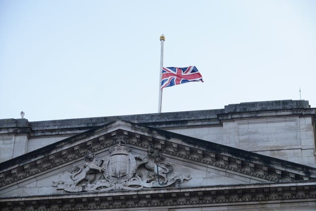 The Union Flag above Buckingham Palace in central London is flown at half mast following the announcement of the death of Queen Elizabeth II. (Yui Mok/PA)