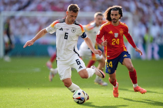 Germany’s Joshua Kimmich (left) in action against Spain's Marc Cucurella (right) during the Euro 2024 quarter-final in Stuttgart
