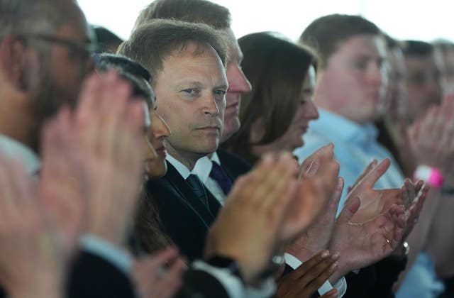 Defence Secretary Grant Shapps looks pensive surrounded by applauding Cabinet ministers during Rishi Sunak's speech