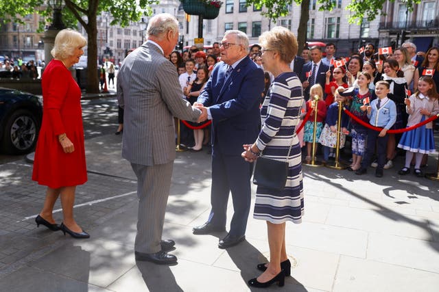 Charles and Camilla are welcomed by the High Commissioner