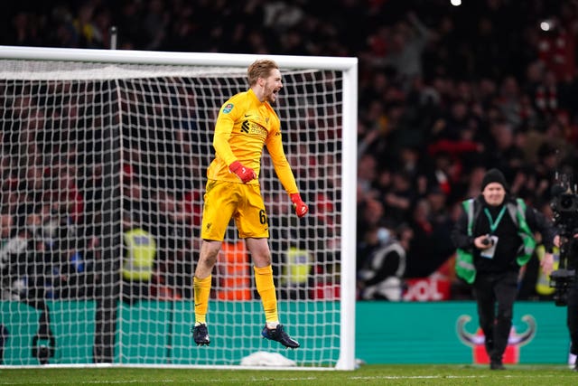 Caoimhin Kelleher celebrates Liverpool's success at Wembley