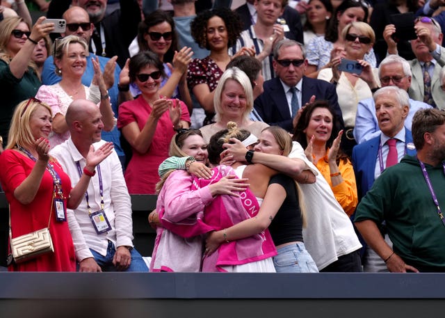 Marketa Vondrousova celebrates with her family and coaching team after her victory on Centre Court