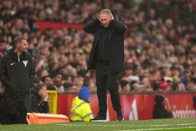 Leicester manager Steve Cooper holds his head during defeat at Manchester United