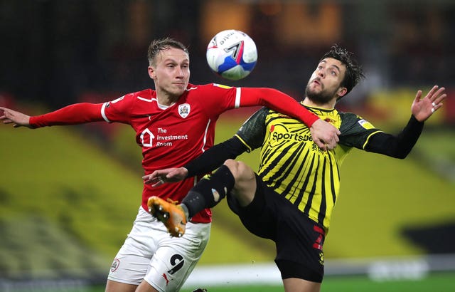 Cauley Woodrow, left, has chipped in with 12 league goals for Barnsley this season