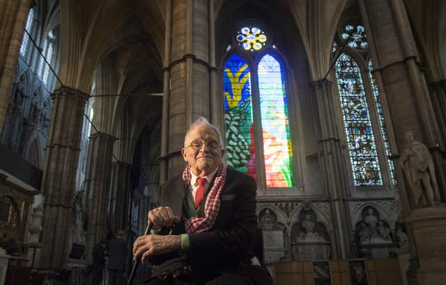 David Hockney in front of The Queen&rsquo;s Window, a stained glass window at Westminster Abbey, which he designed