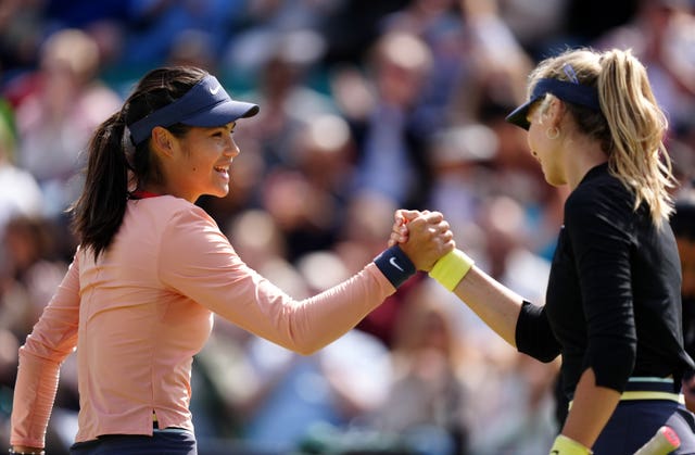 Emma Raducanu, left, shakes hands with Katie Boulter