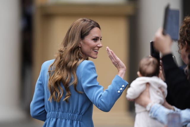 The Princess of Wales waves at the crowds