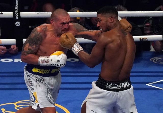 Anthony Joshua, right, dropped a unanimous decision against Oleksandr Usyk last September (Nick Potts/PA)