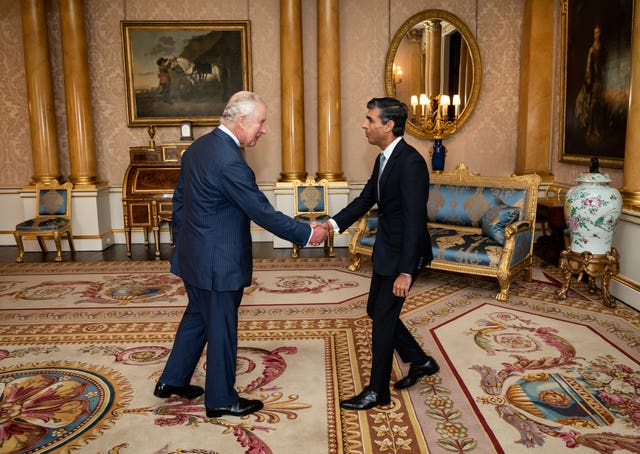 The King shaking hands with Rishi Sunak in October 2022 where he invited the newly elected leader of the Conservative Party to become Prime Minister and form a new government