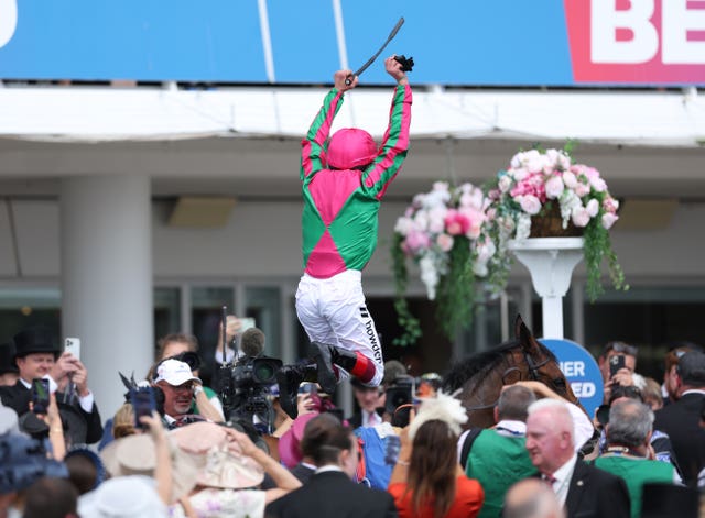 Frankie Dettori performs a flying dismount from Prosperous Voyage 
