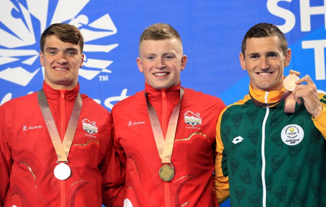 England’s James Wilby (silver), Adam Peaty (gold) and South Africa’s Cameron van der Burgh (bronze) with their medals after the men’s 100m breaststroke final at the Gold Coast Aquatic Centre 