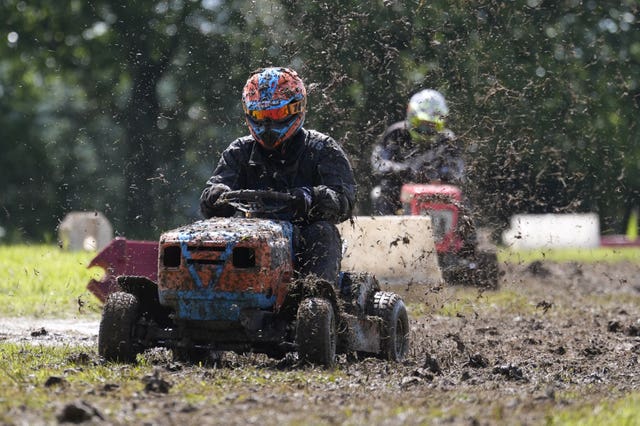 Competitors race in a heat during the World Lawnmower Championships