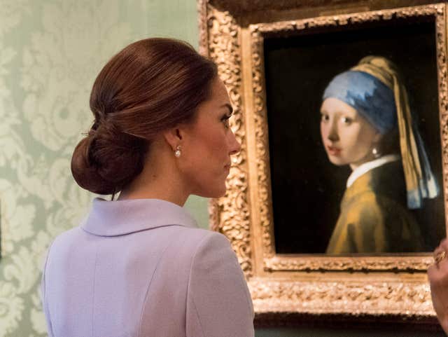 The Duchess of Cambridge views Vermeer's painting Girl with a Pearl Earring during her solo trip to the Netherlands (Arthur Edwards/The Sun)