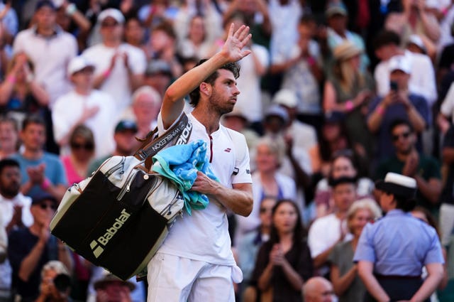 Cameron Norrie waves goodbye to the Centre Court crowd