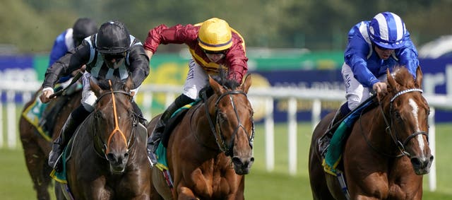 State Of Rest (yellow cap) in the bet365 Champagne Stakes at Doncaster