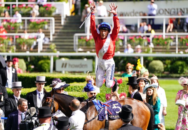 Frankie Dettori performs his trademark flying dismount at Royal Ascot 
