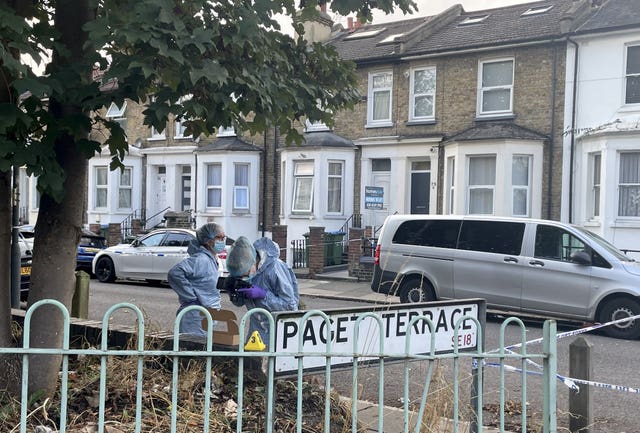 Forensics officers at the scene on Paget Terrace, near the scene in Eglinton Road, Woolwich, south-east London