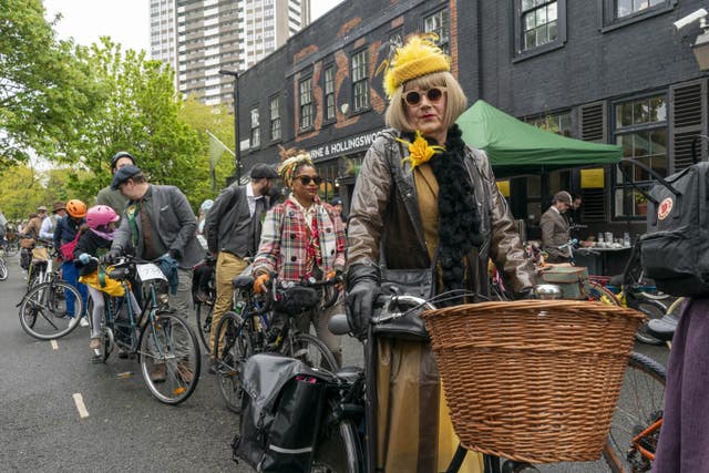 Riders dressed in tweed gathered on their bikes before the start of the annual Tweed Run