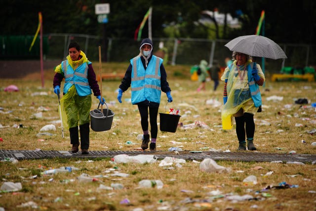 Litter pickers work to clear Worthy Farm