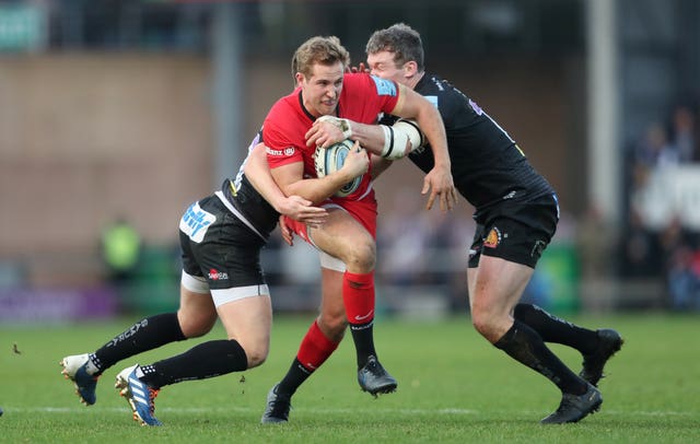 Saracens’ Max Malins is tackled by Exeter’s Joe Simmonds