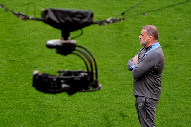 Tottenham manager Ange Postecoglou on the pitch with a television camera suspended overhead