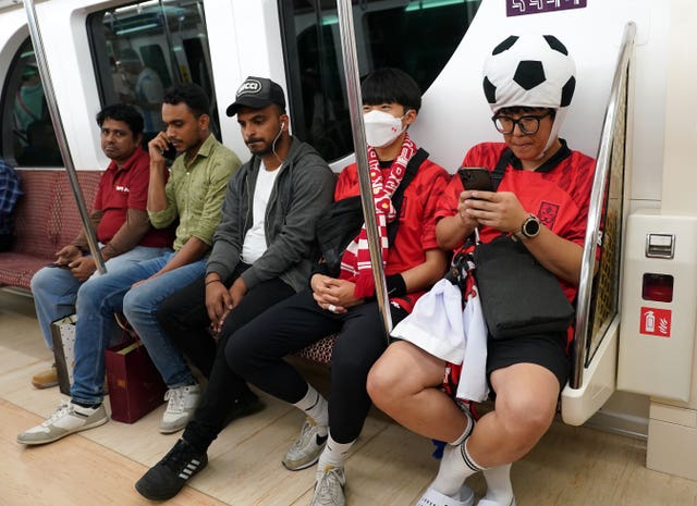 South Korea fans travel on Doha's state-of-the art Metro network 
