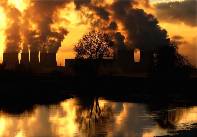 Low winter sunshine highlighting emissions from Drax Power Station near Selby, Yorkshire