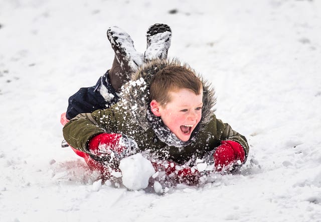 Luke Clarke, seven, sledging in the snow in Chapel-en-le-Frith, Derbyshire (Danny Lawson/PA)