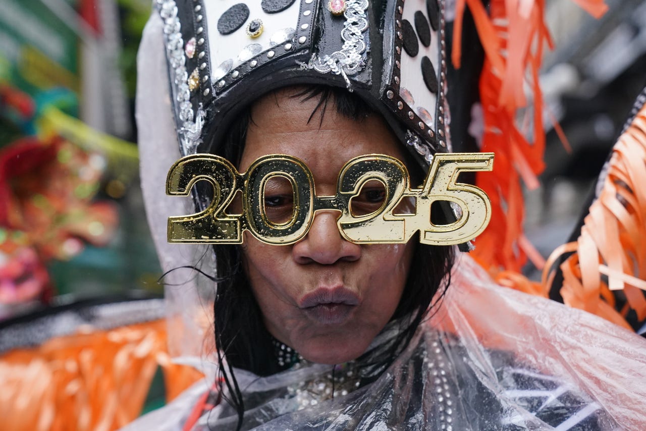 Revellers brave wind, rain and grey skies to watch New Year’s Day