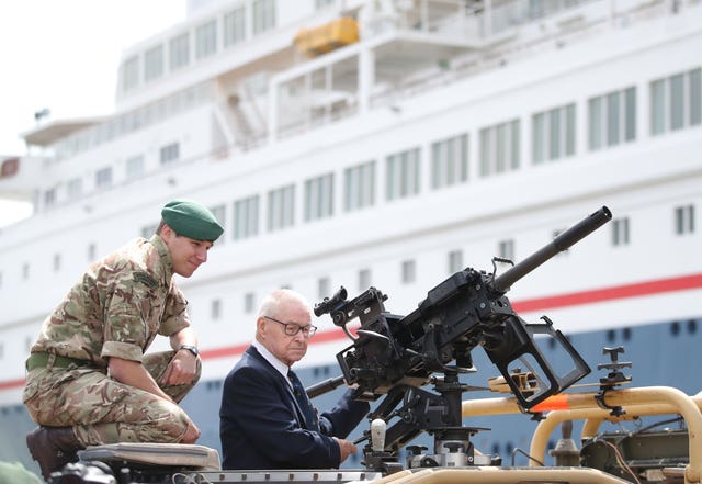 Eric Carter, 94, gets to grips with a Royal Marine Jackal vehicle 