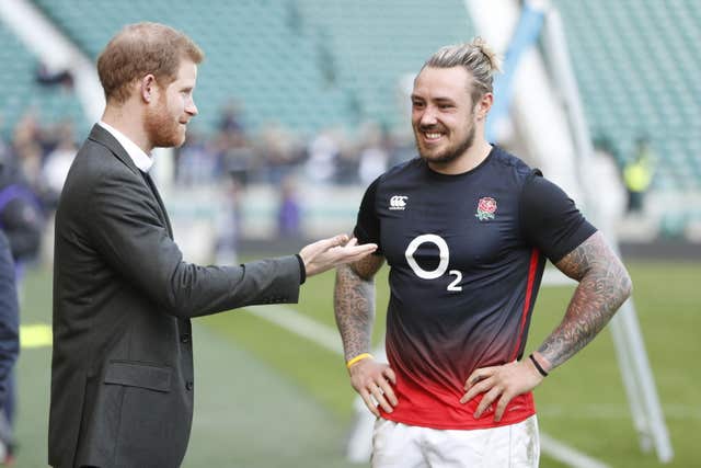 Prince Harry talks tactics with England player Jack Nowell  (Heathcliff O’Malley/The Daily Telegraph/PA)