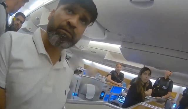 Screen grab from body cam footage of the moment police officers boarded a plane and detained Sara Sharif’s father Urfan Sharif at Gatwick Airport in London