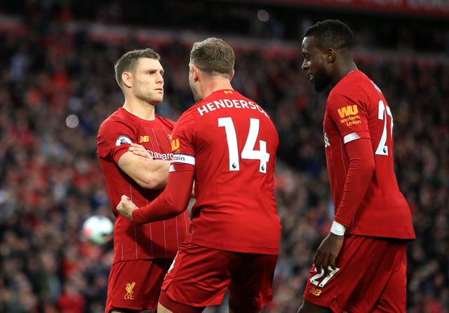James Milner (left) kept his cool to score a stoppage-time penalty as Premier League leaders Liverpool maintained their perfect start at Anfield.