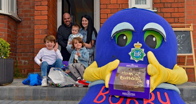 Dexter Lee with parents Anna and Rob Lee, big brother Freddie, baby brother Mason and force mascot Bobby 