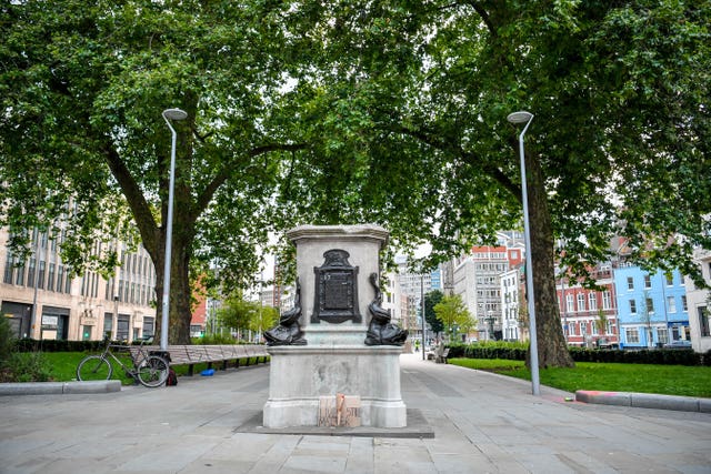 The empty plinth where the statue of the slave trader Edward Colston sat before it was pulled down by Black Lives Matter protestors (Ben Birchall/PA)