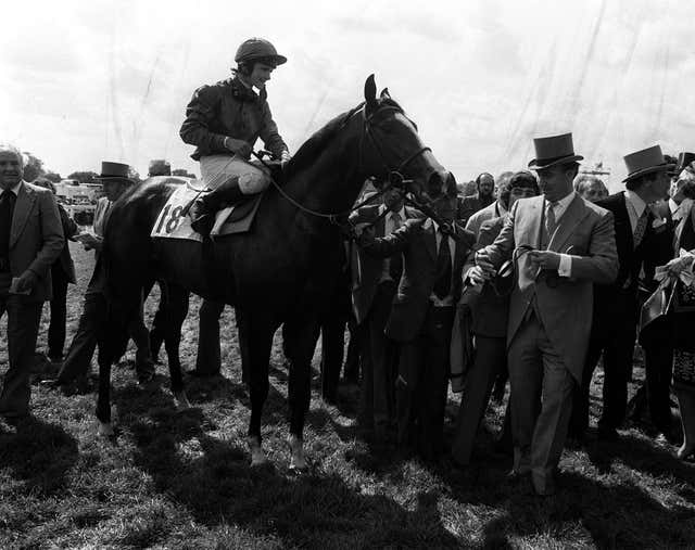 The Aga Khan leads Shergar in after the Derby