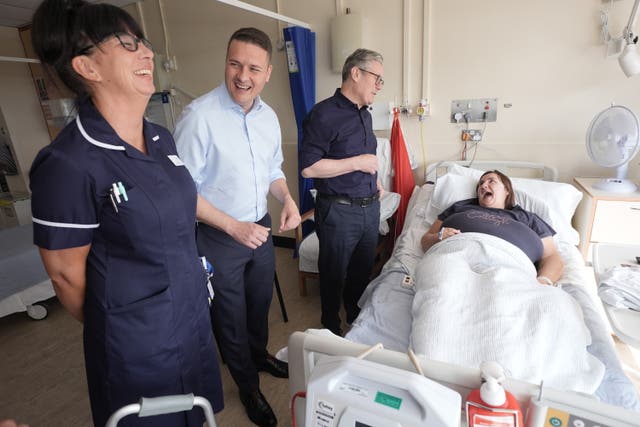 Labour Party leader Sir Keir Starmer and shadow health secretary Wes Streeting meet a patient and nursing staff during a visit to Bassetlaw Hospital