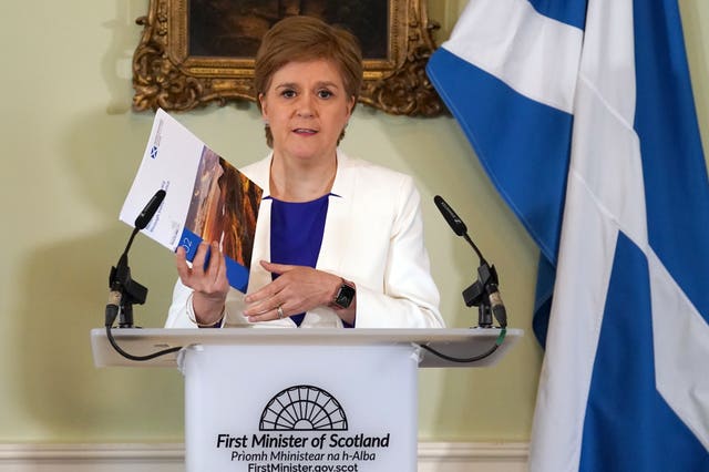 Nicola Sturgeon holding a paper on independence in Bute House