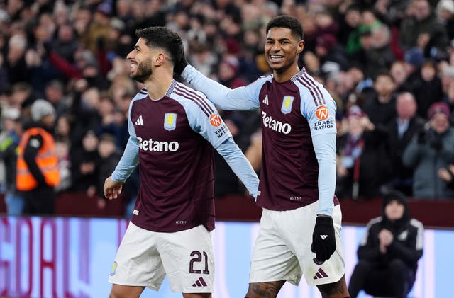 Marco Asensio celebrates with Marcus Rashford after scoring against Cardiff (Bradley Collyer/PA)