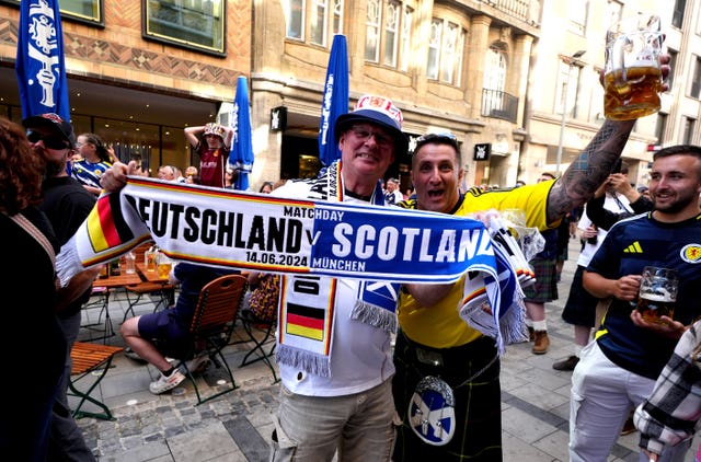 Fans hold up a scarf for the Germany v Scotland match