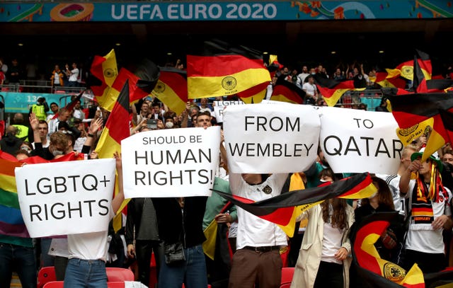 Germany fans hold up signs at Wembley at Euro 2020