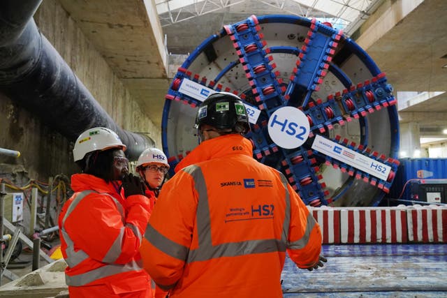 HS2 workers stand in front of tunnel boring machine Karen