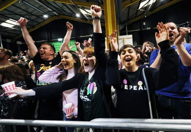 Pro-choice campaigners and supporters celebrate at the count centre in Dublin’s RDS (Brian Lawless/PA)