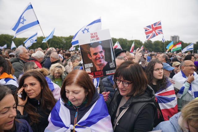 People attending the Remembering October 7 memorial event in Hyde Park, central London